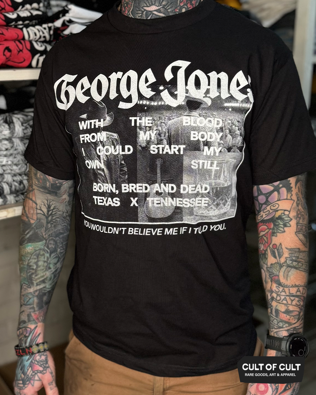 a model showing the front view of the George Jones Born Bred and Dead black short sleeve shirt