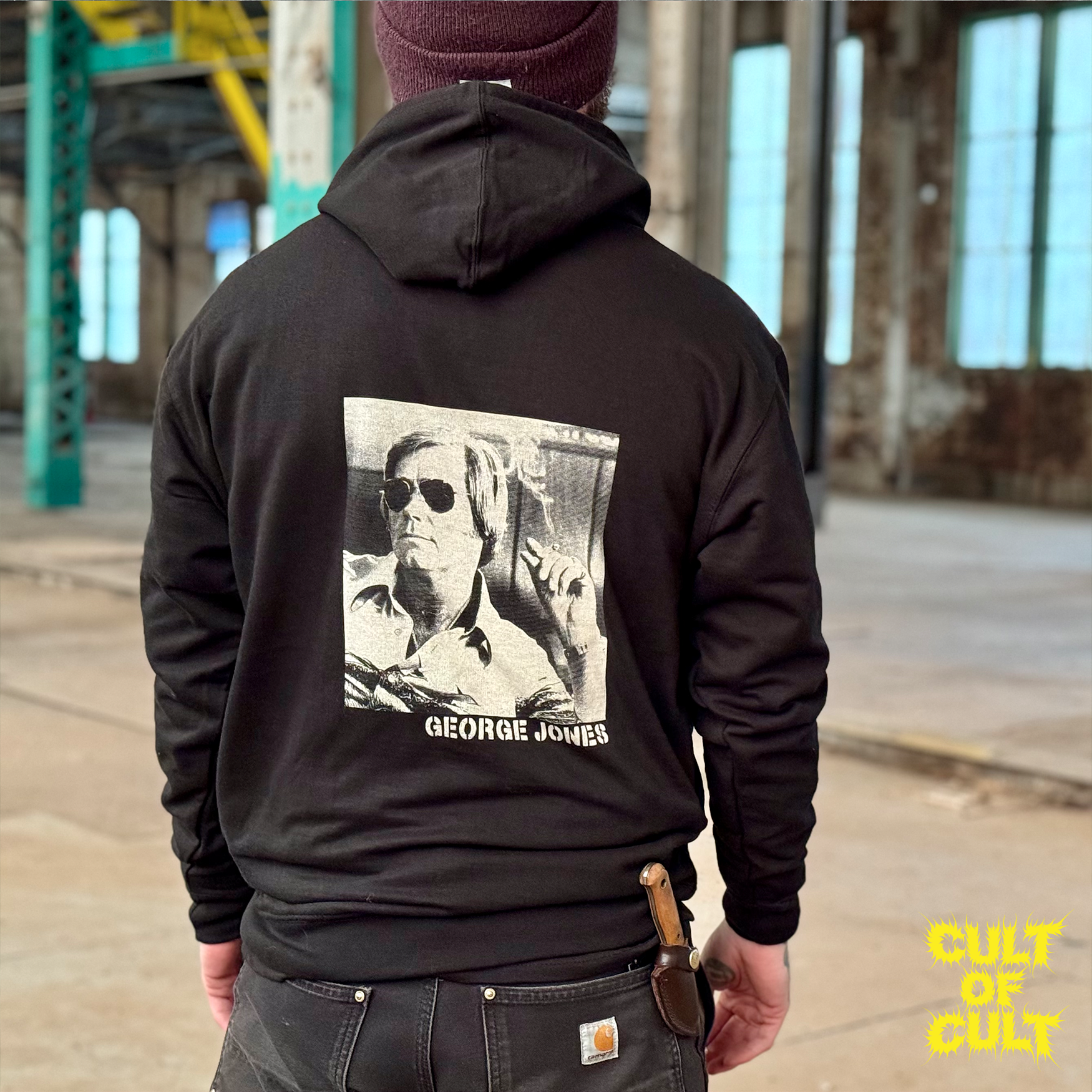 A model wearing the George Jones hoodie, pictured from the back.