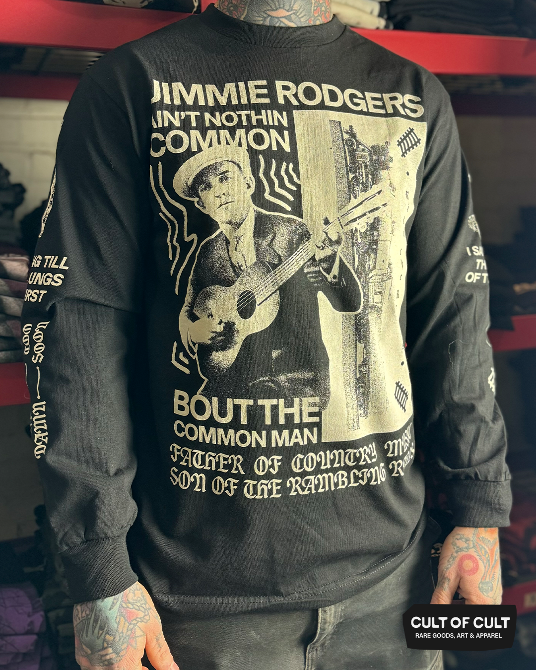 a model pictured from the front, wearing the Jimmie Rodgers black long sleeve shirt