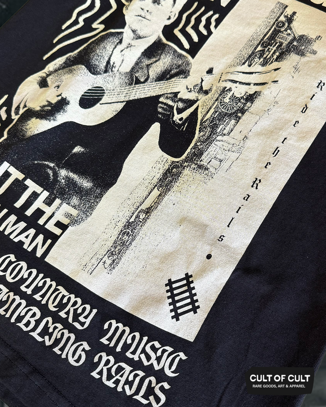 a close up shot of the print of the Jimmie Rodgers black short sleeve shirt