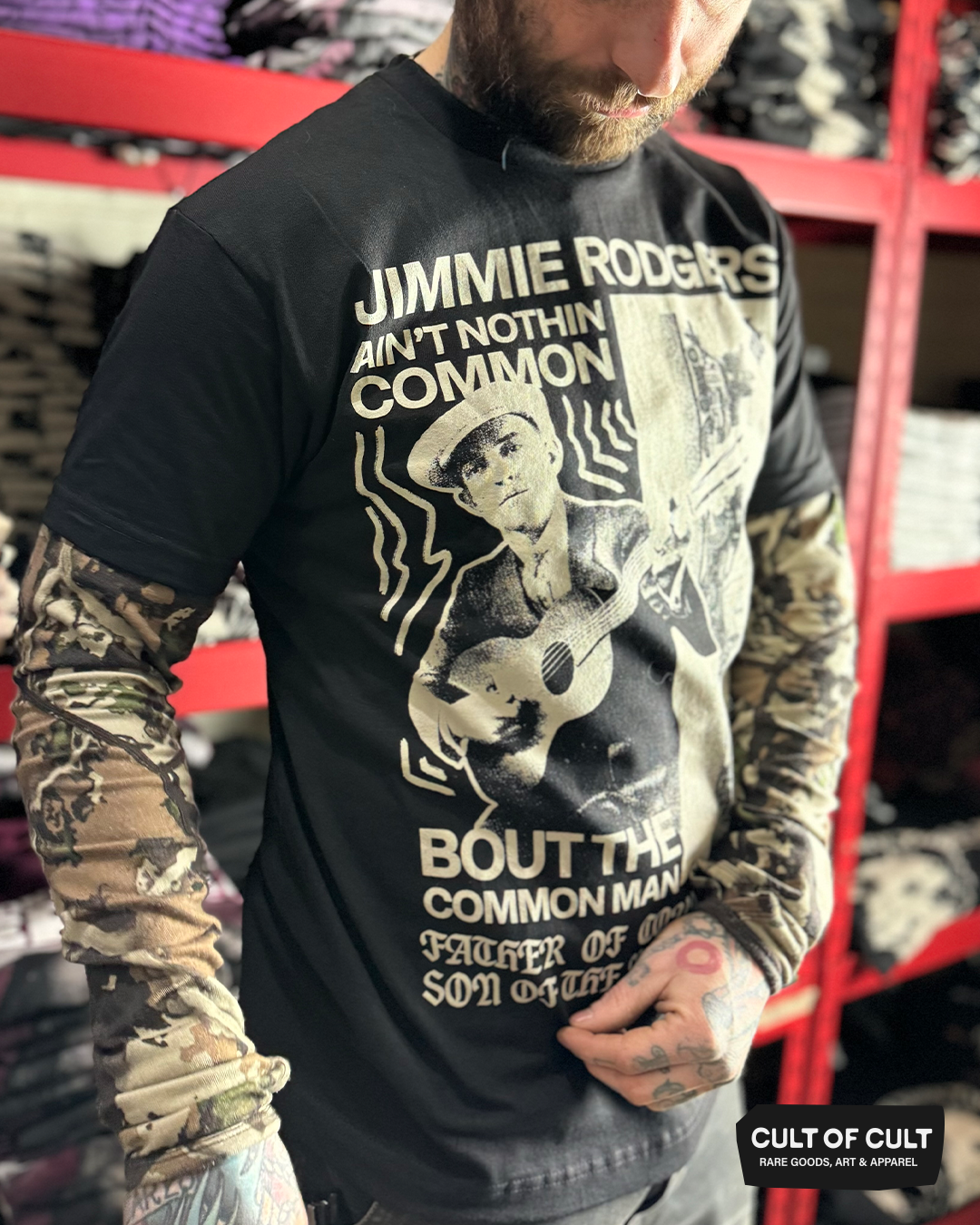 a model wearing the Jimmie Rodgers black short sleeve shirt