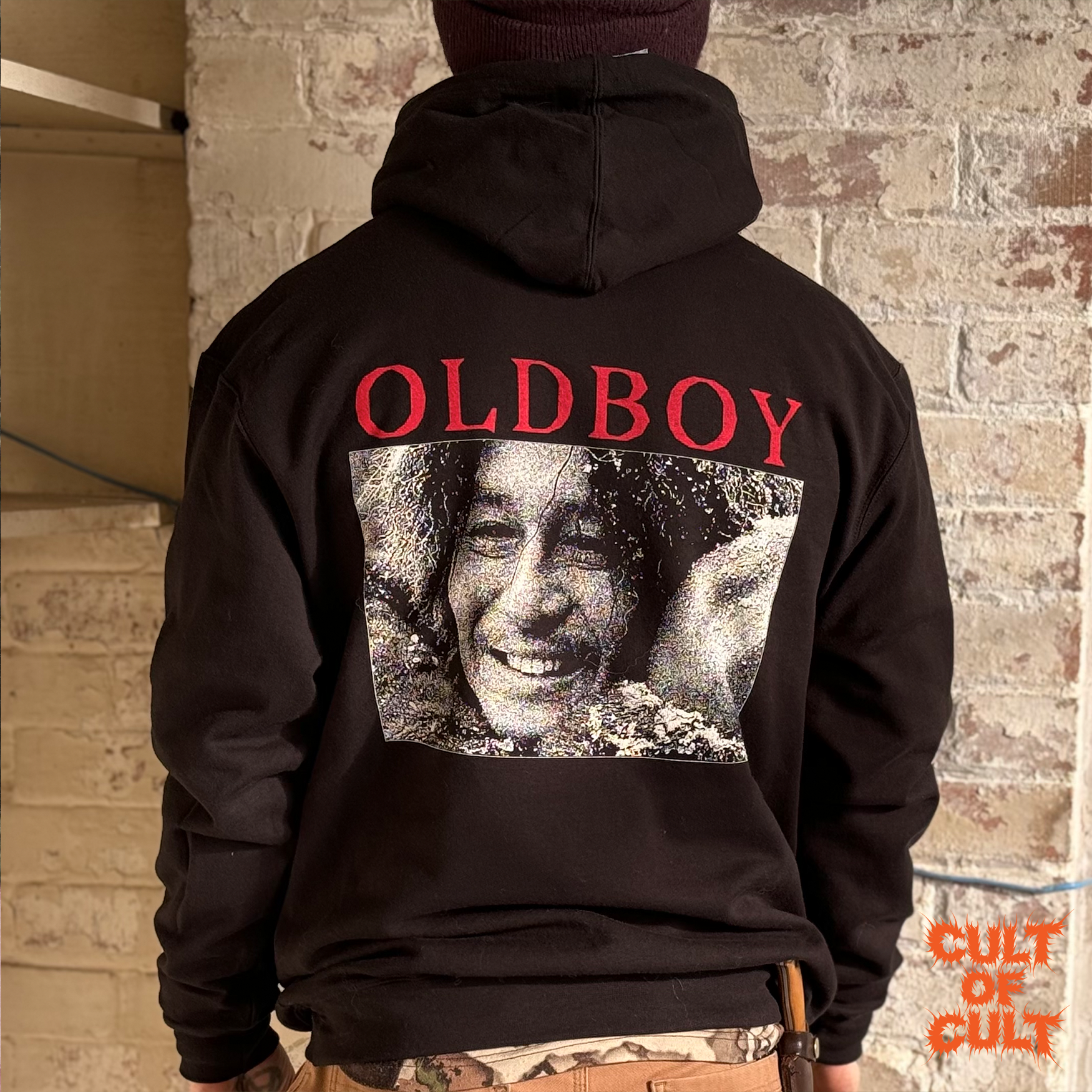 A model wearing a medium sized Oldboy 2003 hoodie