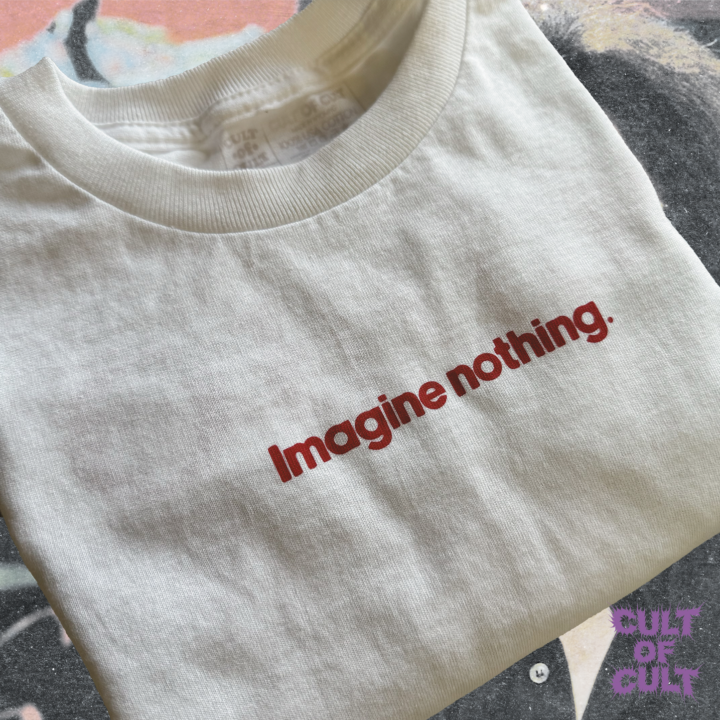 A zoomed in view of the front of the shirt. It reads "Imagine nothing." small and centered on the front chest, with red ink.