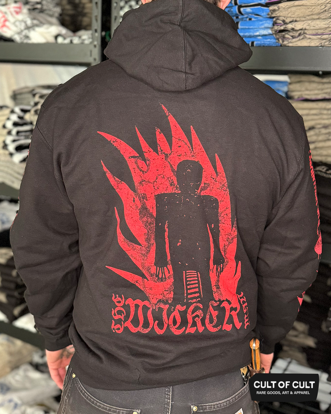 a model showing the back of The Wicker Man 1973 black hoodie