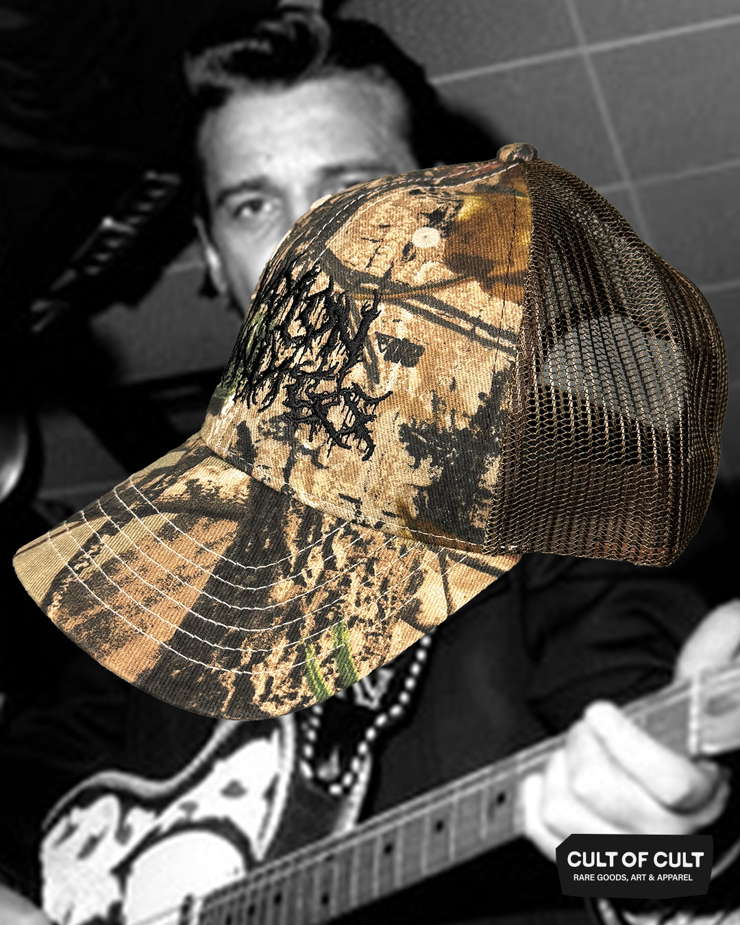 a side view of the black brown and camo Waylon Jennings trucker hat