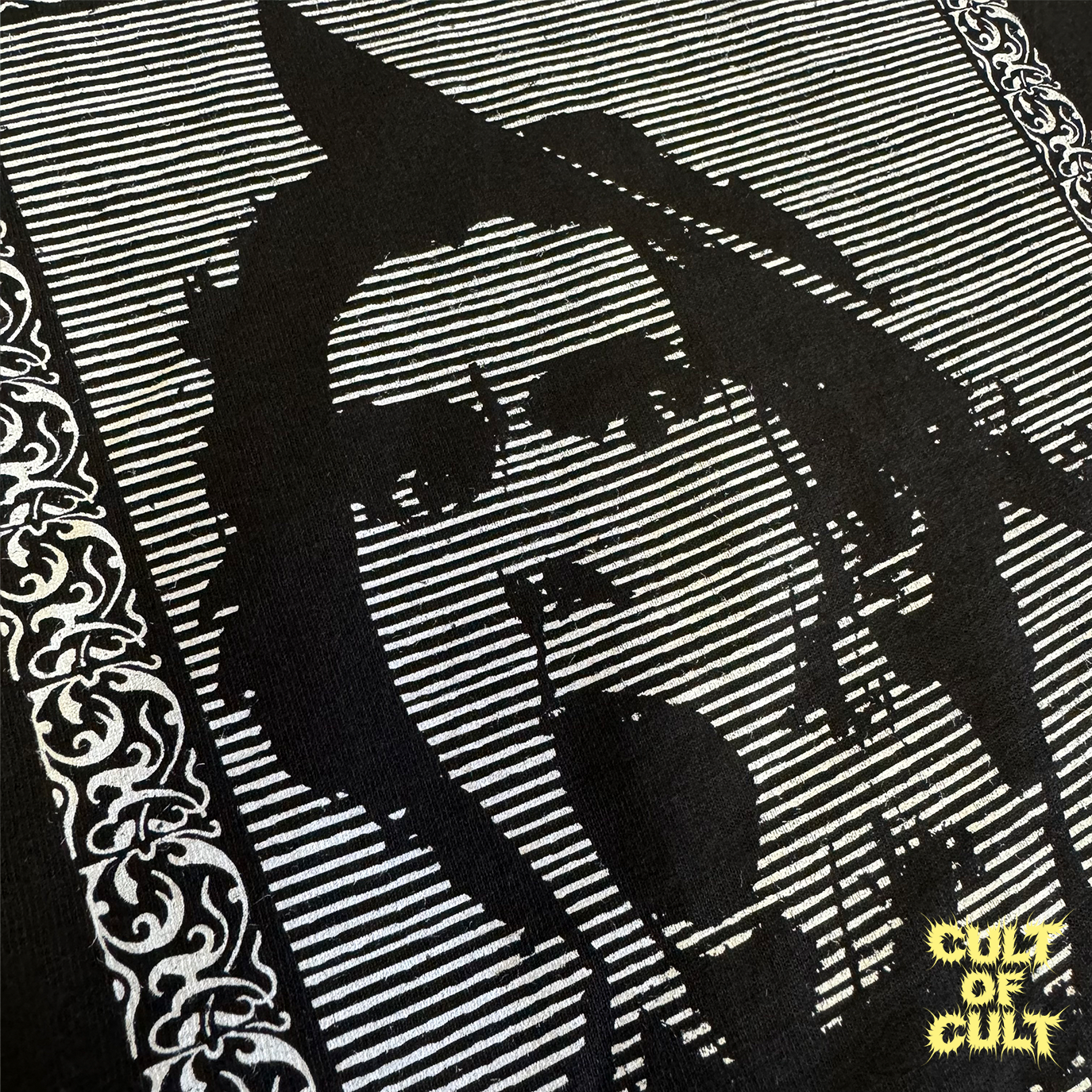 A zoomed in detailed shot of the black Zombie Dawn of the Dead 1978 short sleeve shirt