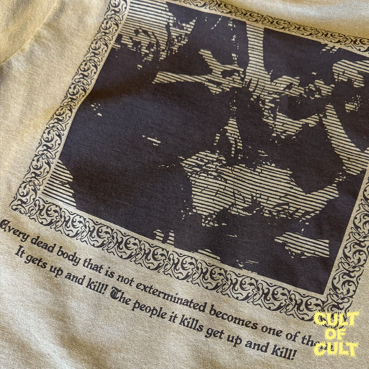 A zoomed in detailed shot of the green Zombie Dawn of the Dead 1978 short sleeve shirt