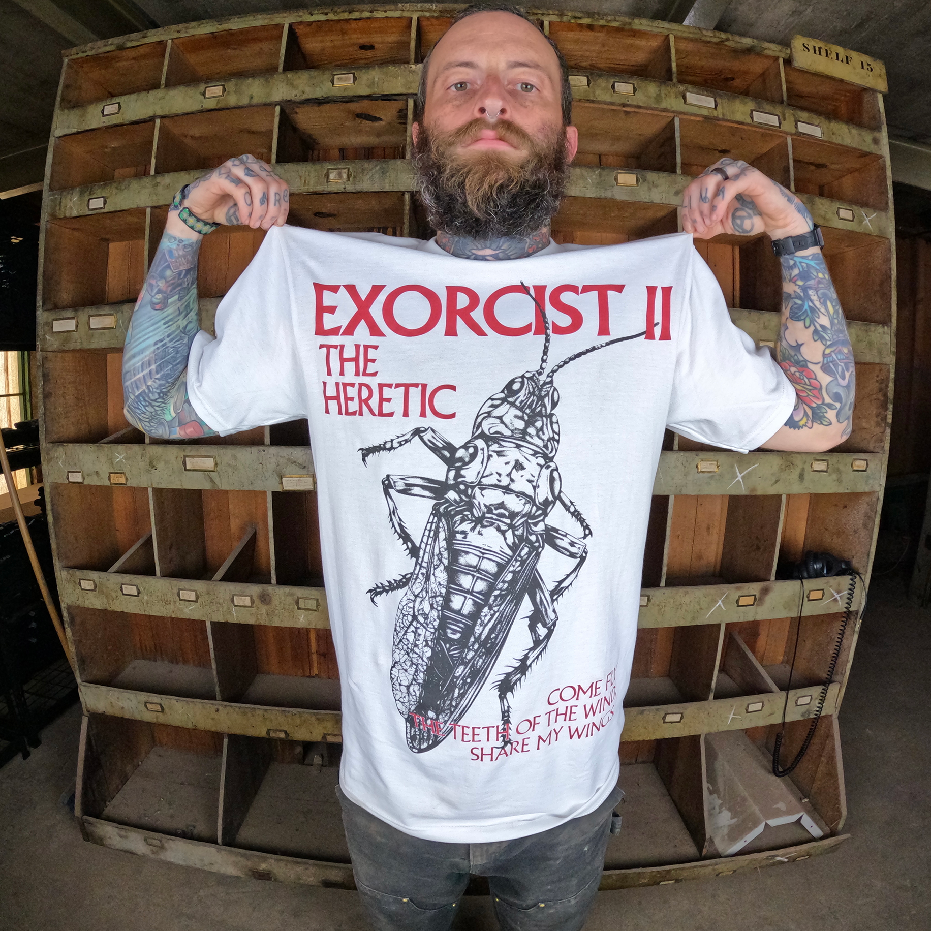 Exorcist 2 The Heretic Short Sleeve Model Holding Up Front of Design